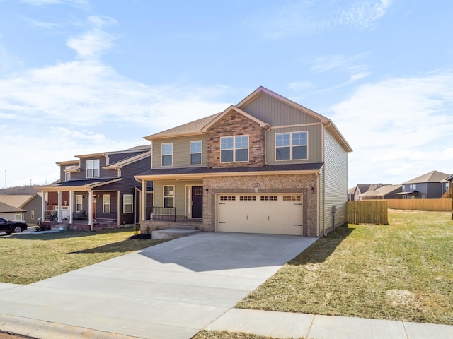 view of front of home featuring driveway, an attached garage, covered porch, fence, and a front yard