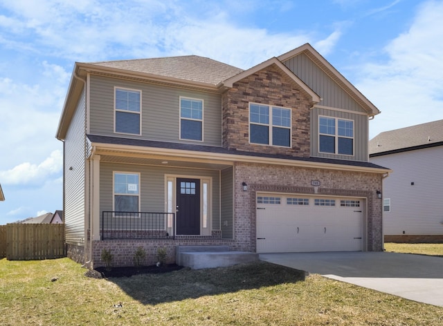 view of front of house featuring a garage, covered porch, fence, driveway, and a front yard