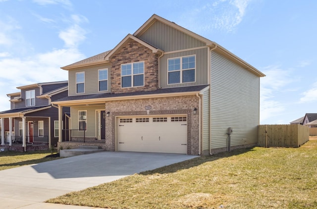 view of front of property featuring an attached garage, fence, stone siding, driveway, and a front lawn