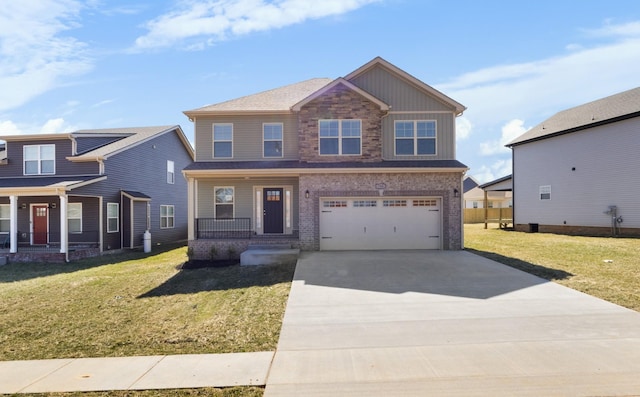 view of front of house with an attached garage, driveway, a porch, and a front yard