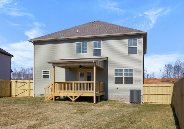 back of house featuring crawl space, a fenced backyard, a yard, and a deck