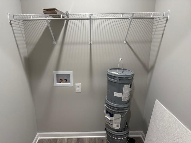 clothes washing area with hookup for a washing machine and wood-type flooring