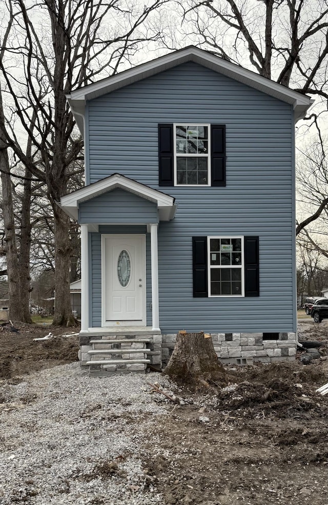 traditional-style home featuring crawl space and entry steps