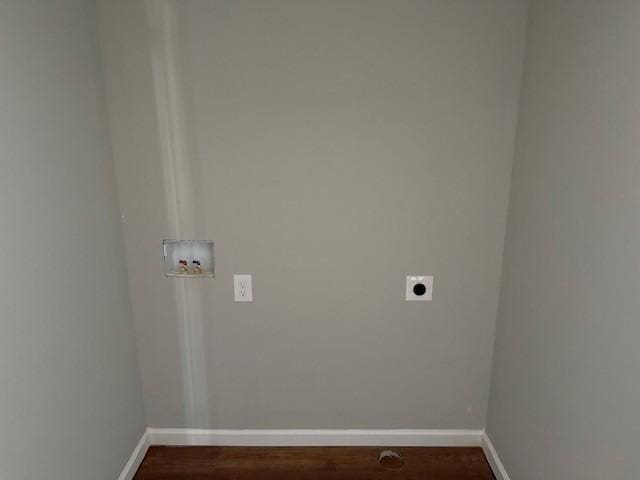 washroom featuring hookup for a washing machine, laundry area, dark wood-type flooring, baseboards, and electric dryer hookup