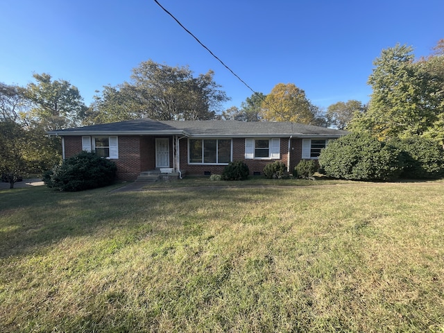 single story home with a front yard