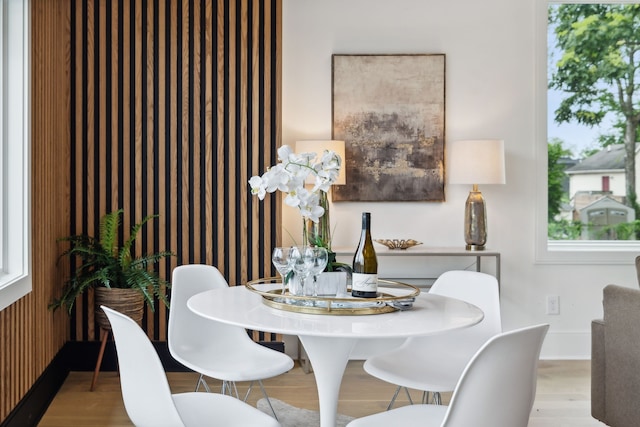 dining space with light wood-type flooring