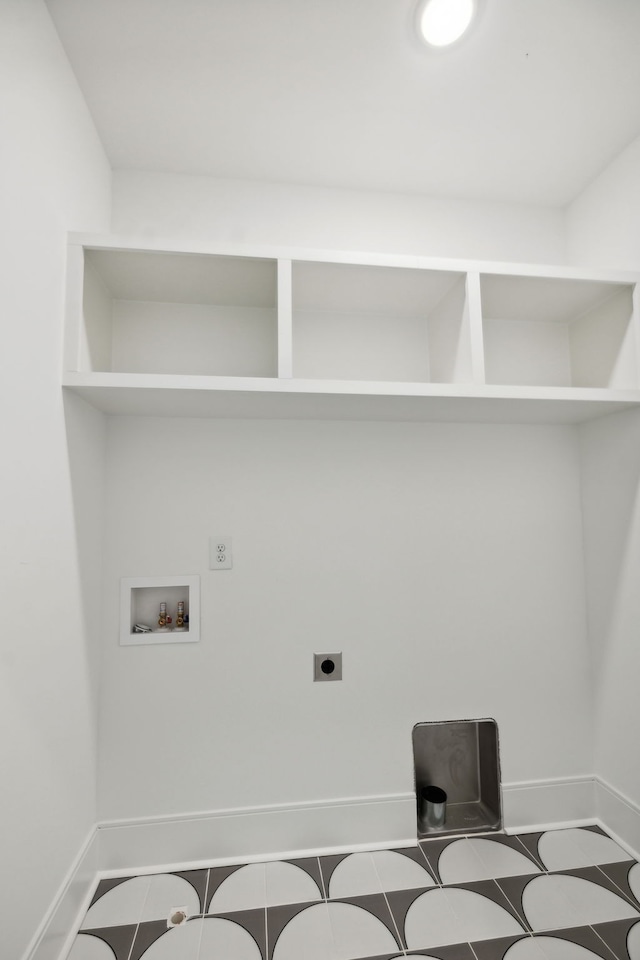 laundry area featuring hookup for an electric dryer, hookup for a washing machine, and tile patterned floors