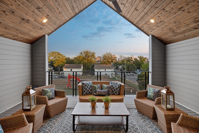 balcony at dusk with an outdoor living space