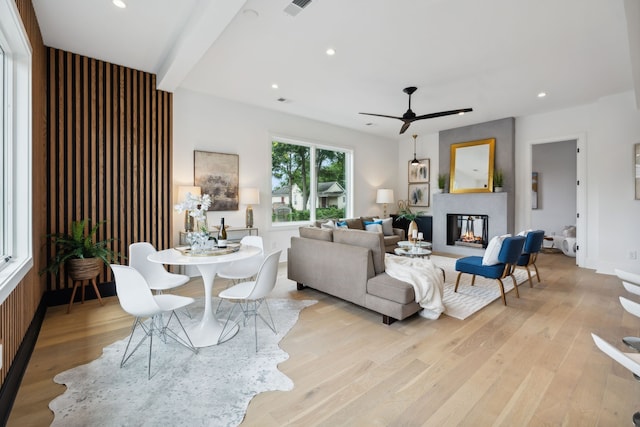 living room featuring ceiling fan and light wood-type flooring