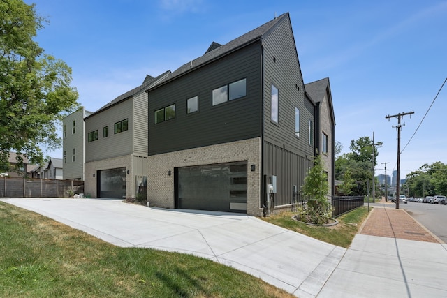 view of side of home featuring a garage