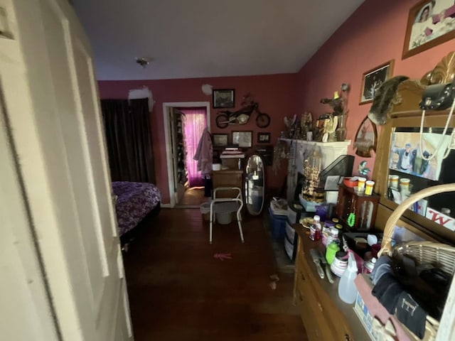 bedroom with dark wood-type flooring