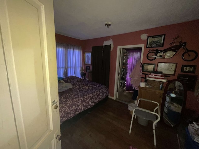 bedroom featuring dark hardwood / wood-style flooring