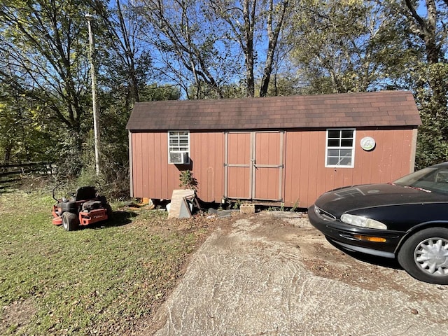 view of outbuilding featuring a yard