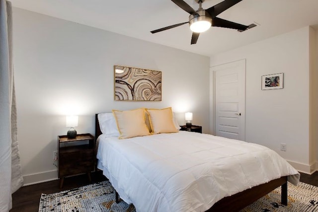 bedroom featuring dark wood-type flooring and ceiling fan