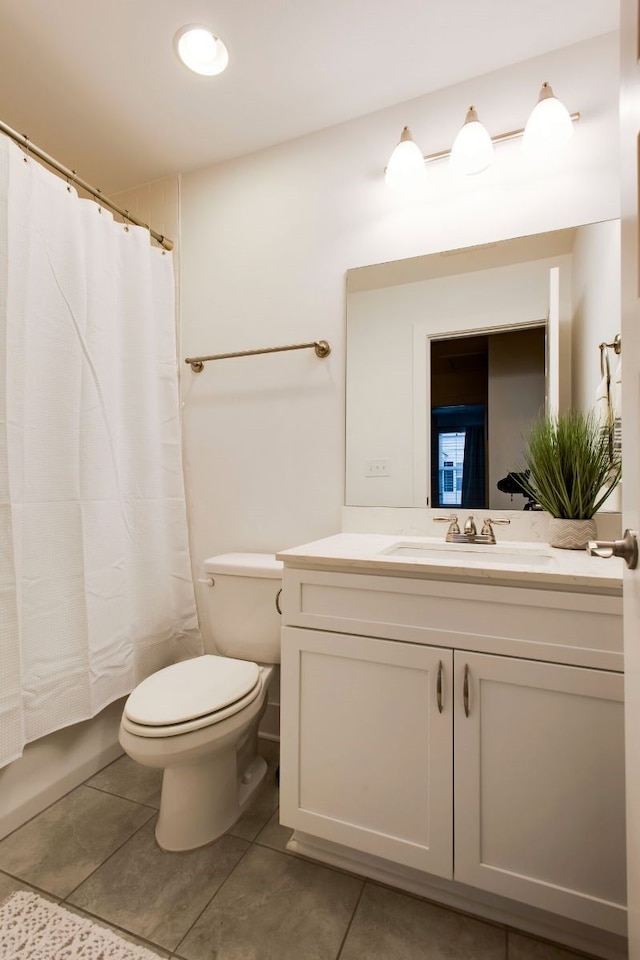 full bathroom featuring vanity, toilet, shower / bath combination with curtain, and tile patterned flooring