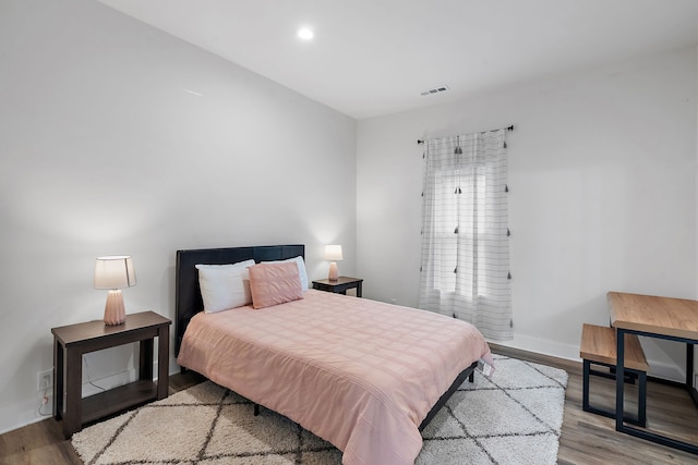 bedroom with light hardwood / wood-style floors