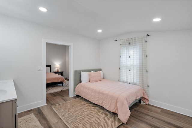 bedroom with wood-type flooring