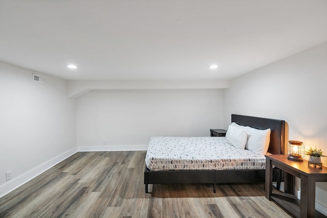 bedroom featuring hardwood / wood-style floors