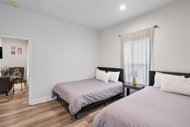 bedroom with light hardwood / wood-style floors