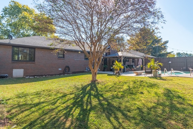 view of yard with a gazebo, a fenced in pool, and a patio