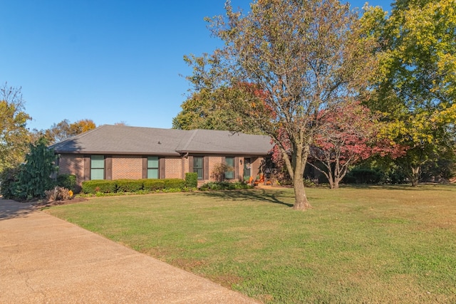 ranch-style home with a front lawn