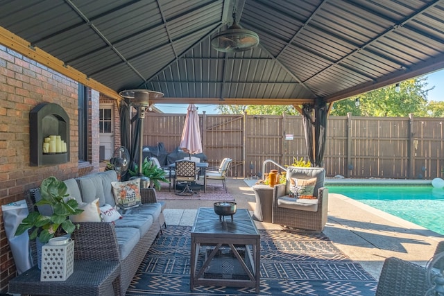 view of patio / terrace with a gazebo, a fenced in pool, and outdoor lounge area