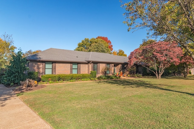 ranch-style house with a front yard