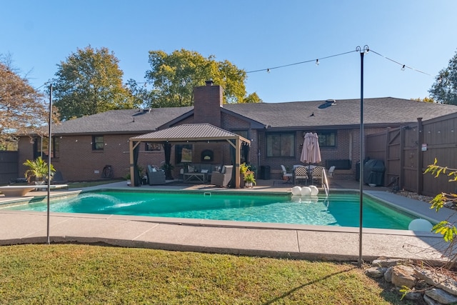 view of swimming pool with a patio, a gazebo, and a yard