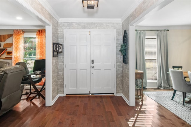 foyer with crown molding and dark hardwood / wood-style flooring