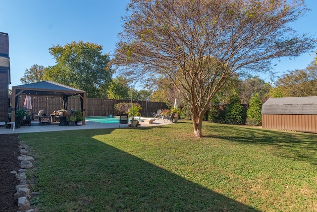 view of yard with a patio, a gazebo, and a fenced in pool