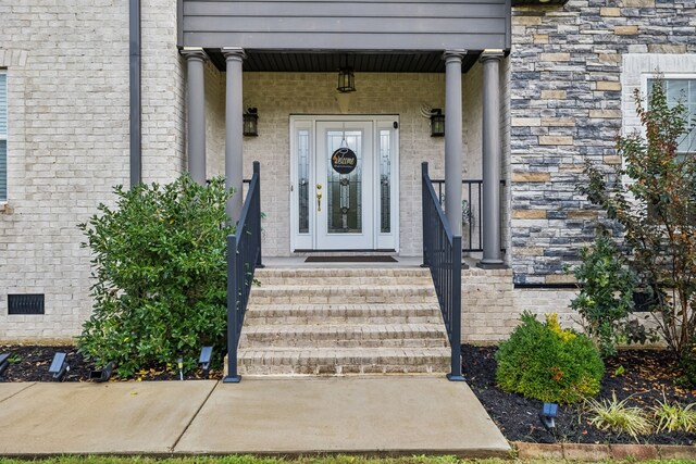 view of exterior entry featuring a porch