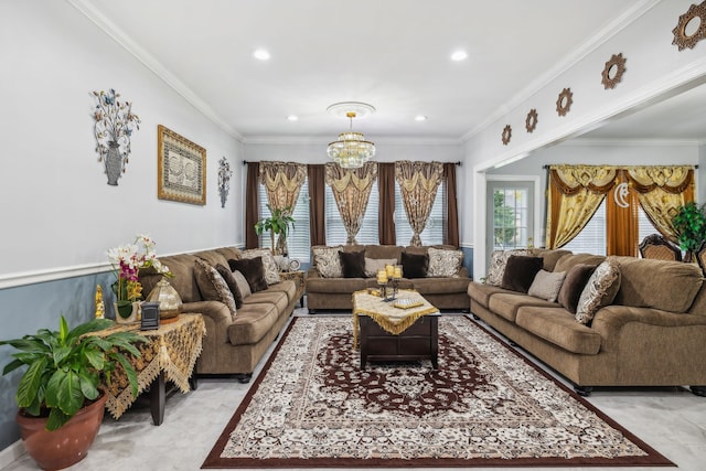 living room with an inviting chandelier and ornamental molding