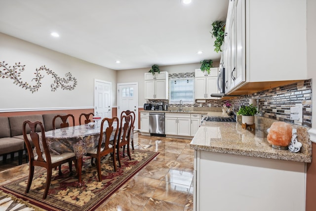 dining room featuring sink