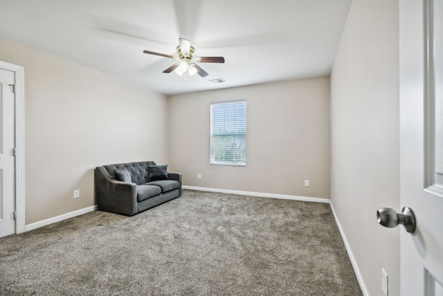 living area with carpet floors and ceiling fan