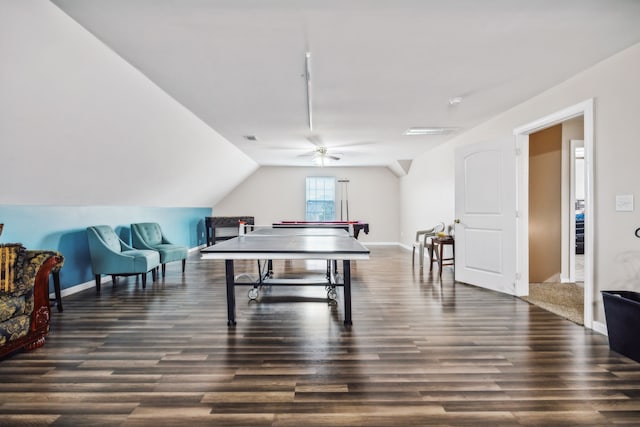 recreation room with ceiling fan, lofted ceiling, and dark hardwood / wood-style floors