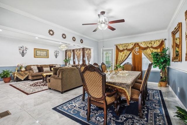 dining space with crown molding, light tile patterned floors, and ceiling fan