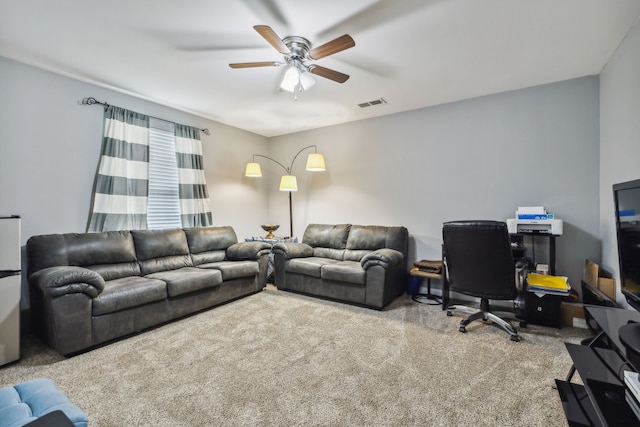 living room featuring carpet flooring and ceiling fan