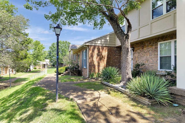 view of property exterior featuring a lawn