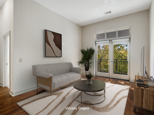 living room featuring french doors and dark hardwood / wood-style floors