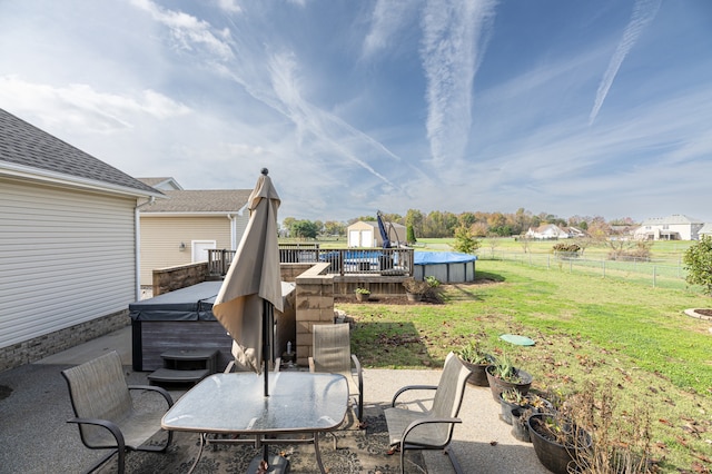 view of patio with a pool with hot tub