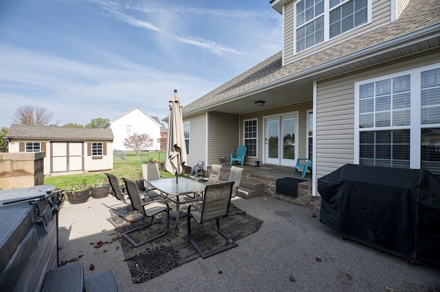 view of patio / terrace with a shed and area for grilling