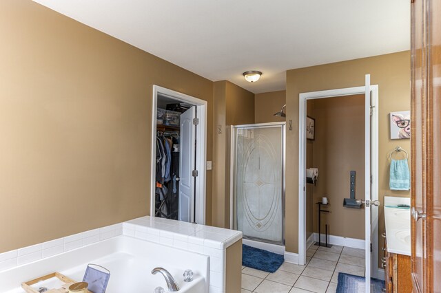 bathroom with tile patterned flooring and plus walk in shower