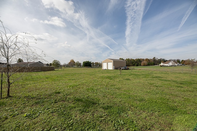 view of yard featuring a shed and a rural view