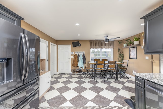 dining area featuring beverage cooler and ceiling fan