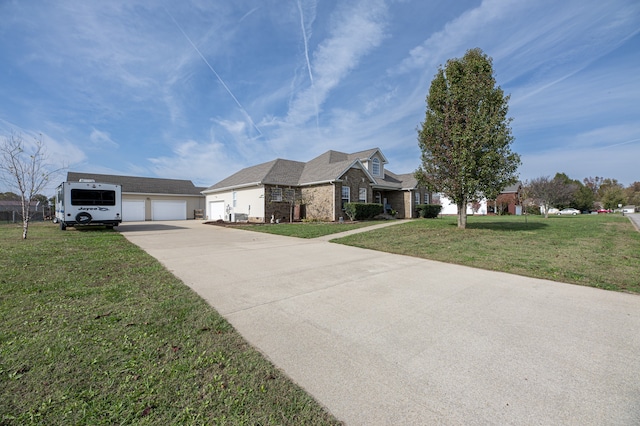 view of front of property featuring a garage and a front yard