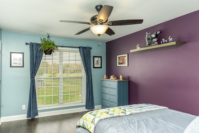 bedroom featuring ceiling fan and dark hardwood / wood-style floors