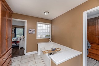 bathroom with tile patterned flooring