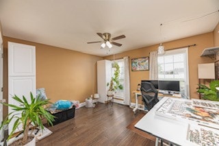 office featuring dark hardwood / wood-style floors and ceiling fan