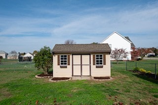 view of outdoor structure with a lawn