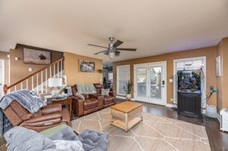 living room with hardwood / wood-style flooring and ceiling fan